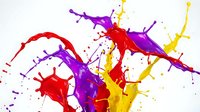 Vibrant colorful paint splashes in red purple yellow creating dynamic abstract explosion on white background for creative design projects.