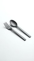 Modern stainless steel fork and spoon set isolated on white background for kitchen dining restaurant culinary design projects.