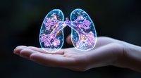 Glowing translucent lungs with pink and blue ethereal details float above an open palm, representing medical visualization, health awareness, and respiratory system anatomy.