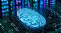 Digital fingerprint hologram on computer circuit board with glowing blue lights representing cybersecurity biometric authentication technology.