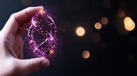 Magical glowing pink constellation held between fingers against dark background with bokeh lights, creating mystical cosmic energy portal effect.