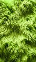 Bright lime green furry texture with long wavy strands creating a plush, luxurious surface pattern. Suitable for fashion and interior design backgrounds.