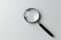Classic magnifying glass with black handle on white background, essential tool for investigation, research, and detailed examination.