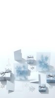 Elegant winter gift boxes with silver ribbons and snowflake decorations on white background for holiday season celebrations and festive occasions.