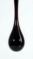 Sleek black teardrop vase with glossy finish isolated on white background, ready for interior design, home decor, and product mockup applications.