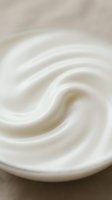 Creamy white swirl texture with smooth, flowing waves ideal for skincare, cosmetics, dairy, and luxury product backgrounds.