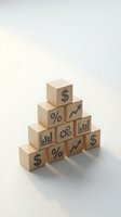 Wooden blocks arranged in pyramid with financial symbols including dollar signs, percentage, charts and gears representing business growth and investment strategy.