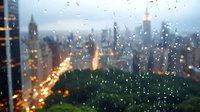 Rainy evening cityscape with bokeh lights through wet window, overlooking Central Park and Manhattan skyline. Urban landscape with glowing streets and skyscrapers in twilight.