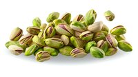 Fresh green pistachio nuts scattered in pile, shells partially opened showing nutritious kernels inside, isolated on white background for food packaging design.