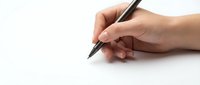 Hand holding black pen ready to write on clean white paper surface for business documentation and creative writing projects.