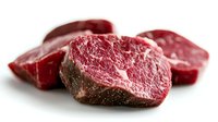 Fresh raw beef steaks with marbled texture isolated on white background for culinary and cooking projects.