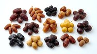Assorted dried fruits and nuts collection arranged in groups on white background isolated for healthy snacking and cooking ingredients design use.