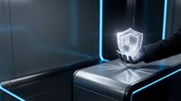 Businessman hand holding glowing shield icon on digital device, representing cybersecurity, data protection, and network security solutions for business technology.