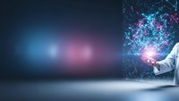 Businessman hand holding glowing digital network connections with data visualization and futuristic technology interface on dark background.