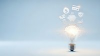 Glowing light bulb with floating business icons representing innovation, creativity and entrepreneurial ideas for startup success and growth strategies.