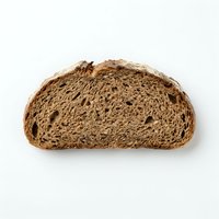Whole wheat bread slice with visible air pockets, isolated on white background, suitable for food packaging, bakery marketing, and culinary design projects.