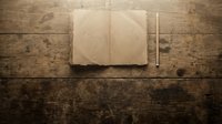 Open notebook with blank pages and pencil on rustic wooden table surface, suitable for writing, journaling, education, and creative projects.