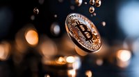 Shiny golden bitcoin coin floating in dark space with blurred bokeh lights background, cryptocurrency concept for financial technology and banking.