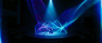 Abstract blue holographic crown with glowing geometric lines and light rays on dark background, suitable for technology, luxury, and digital design projects.