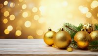 Golden Christmas ornaments with pine branches on wooden surface against warm bokeh background for holiday decorations.