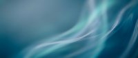 Smooth flowing waves of teal and blue create an abstract motion background with soft, blurred curves ideal for corporate presentations, website headers, and digital design projects.