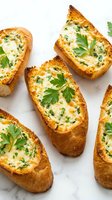 Garlic bread slices topped with melted cheese and fresh parsley on white marble surface for appetizer recipes and Italian cuisine cooking content.