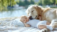 Tender moment of sleeping baby in white onesie cuddling with gentle golden retriever dog on blanket outdoors near lake, representing friendship and protection.