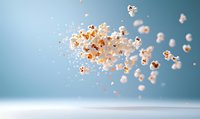 Flying popcorn kernels scattered in motion against blue background, dramatic lighting creates depth and shadow for cinematic effect, floating food photography.
