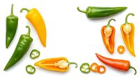 Fresh colorful chili peppers collection with sliced pieces isolated on white background for cooking ingredients and spicy food design projects.