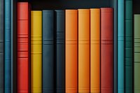Colorful book spines arranged in row showing vibrant spectrum of red, yellow, orange and teal hardcover books on shelf, creating minimalist linear pattern.