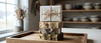 Stacked handmade soap bars with natural ingredients tied with twine on wooden tray, rustic home decor and wellness gift packaging.