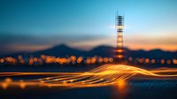 Glowing light trails against mountain silhouette at dusk with communication tower and city bokeh lights creating magical urban nightscape atmosphere.