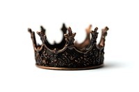 Antique bronze crown with intricate floral patterns and ornate details photographed in soft focus against white background, creating royal medieval atmosphere.