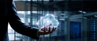 Businessman holding glowing cloud computing hologram in modern data center server room representing digital transformation and technology solutions.