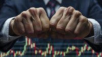 Close-up of businessman's clenched fists over financial market chart background, symbolizing tension and determination in trading and investment decisions.