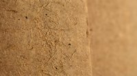 Natural cork texture close-up showing organic grain patterns and porous surface detail for sustainable material design and eco-friendly packaging concepts.