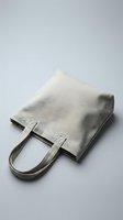 Beige linen tote bag with handles isolated on white background, ready for branding and design mockups.