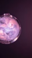 Translucent sphere with swirling pink and purple liquid or gas inside, creating an ethereal, glowing effect against a dark background. Suitable for abstract, sci-fi, and design projects.