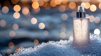 Luxury skincare serum bottle with golden pearls on textured surface against warm bokeh lights background for premium beauty and cosmetics advertising.