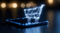 Glowing shopping cart icon floating above laptop keyboard with sparkle effect and bokeh lights in background, modern e-commerce concept for online retail business.