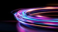 Glowing neon light trails curve in vibrant pink, purple and blue colors against dark background creating dynamic motion effect for technology designs.