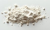 White powder substance with measuring spoon scattered on plain background, useful for cooking, baking, pharmaceutical, or cosmetic industry concepts.