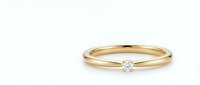 Gold engagement ring with small diamond solitaire on clean white background, isolated jewelry piece for wedding and romance designs.