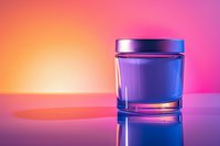 Purple glass cosmetic jar on reflective surface with vibrant orange and pink gradient background, studio lighting creates elegant shadow and reflection.