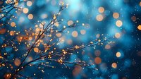 Magical winter scene with frost covered tree branches against deep blue background, illuminated by glowing golden bokeh lights creating dreamy atmosphere.
