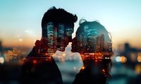 Romantic double exposure silhouette of young couple against illuminated cityscape with skyscrapers and sunset sky, creative urban photography for valentines themes.