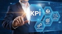 Business professional touching KPI key performance indicator interface with hexagonal icons showing strategy, data analytics, goals and teamwork concepts.