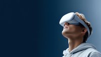 Young woman wearing virtual reality headset looking up with wonder and amazement against blue gradient background for technology and innovation concepts.