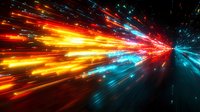Dynamic light trails burst through space in vibrant orange and blue colors creating dramatic speed effect with glowing streaks and particles against dark background.