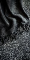 Abstract black and silver textured background with flowing liquid-like patterns and granular surface details creating dramatic contrast and depth for luxury designs.